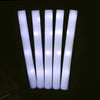 A set of five white glow foam sticks arranged vertically against a dark background.