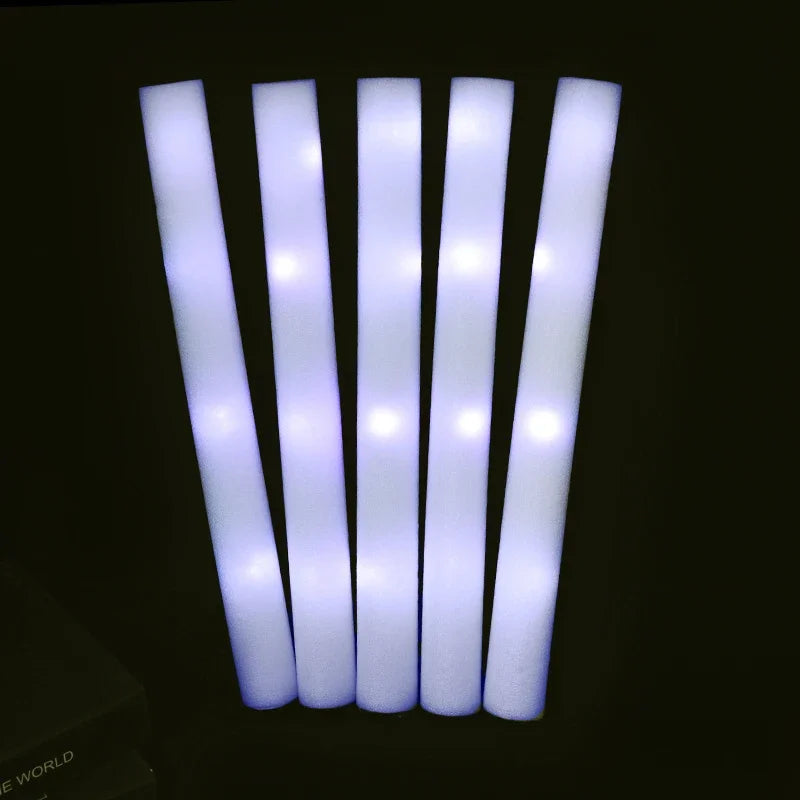 A set of five white glow foam sticks arranged vertically against a dark background.