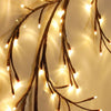 Flexible willow branch LED lights with warm white illumination used for home decor