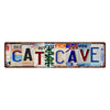 Vintage humorous lowrider metal tin sign with the word CATCAVE carved into it.