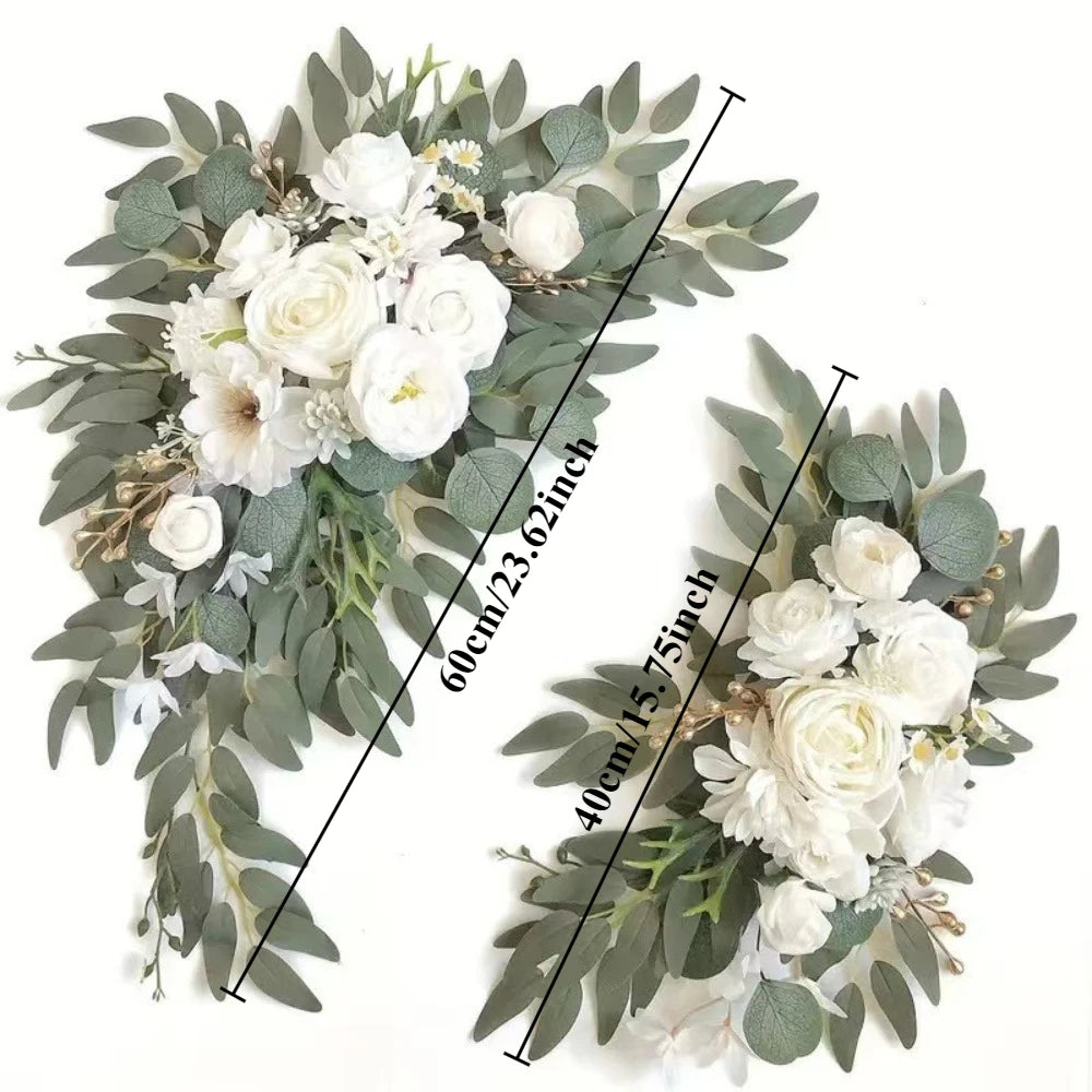 A floral arrangement featuring white roses and greenery for a wedding arch kit.
