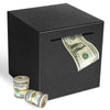 A black decorative metal piggy bank with a slot for coins and bills, showing US currency inside.