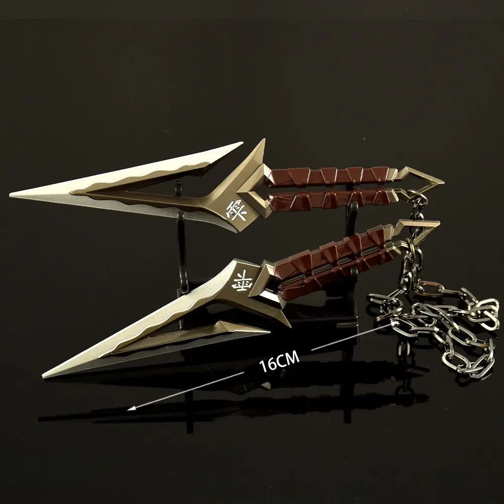 A full-size replica katana prop with a gold blade and red hilt, displayed on a dark surface.