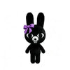 Black plush toy with bunny ears and a purple bow.