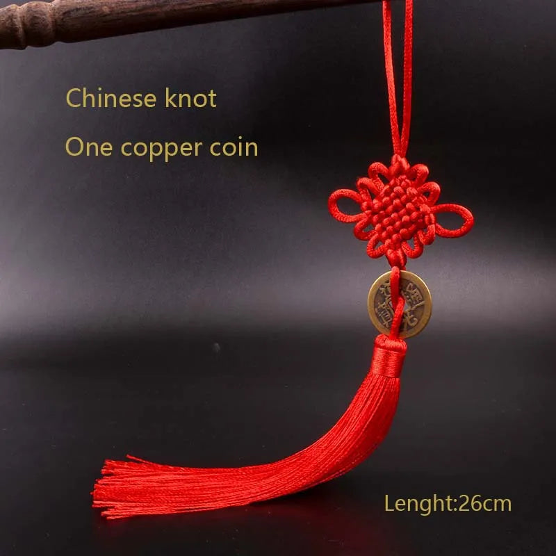 Red silk thread pendant featuring a Chinese knot and an antique copper coin.