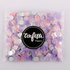 Bag of multicolor paper confetti poppers in shades of pink and purple.