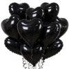 A bunch of black heart-shaped foil balloons tied together.