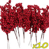 A cluster of artificial red holly berry stems used for Christmas decor.