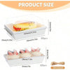 White minimalist boxes for pastries and bread with a Swiss roll inside, along with twine.