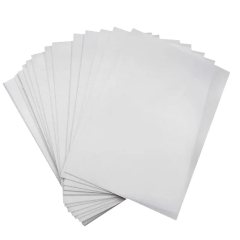 A stack of white A4 edible wafer paper sheets for cake decorating.