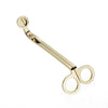 A pair of stainless steel candle wick trimmer scissors with a small trimming tool.