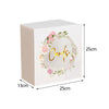 A rectangular, light beige acrylic gift box with a circular floral wreath design on the lid.