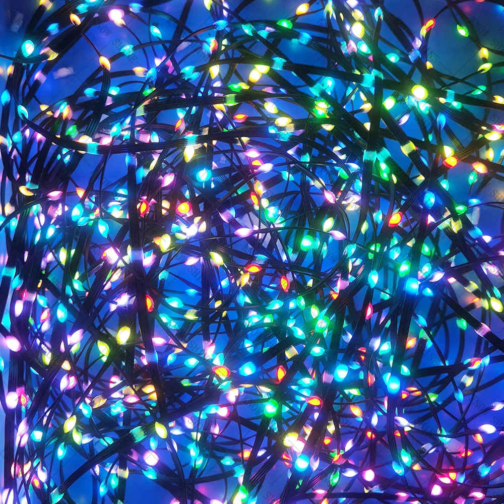 A close-up shot of colorful LED string lights with blue background and dark wires.