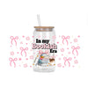 A glass jar filled with decorative stickers and a straw, featuring the text In my Bookish Era.