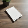 A rectangular silver photo frame with a magnetic visor clip holder resting on a wooden surface.