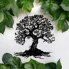 Black silhouette of a large tree with roots on a white background surrounded by green leaves
