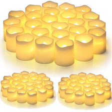 A collection of glowing yellow LED tea lights arranged in a cluster.
