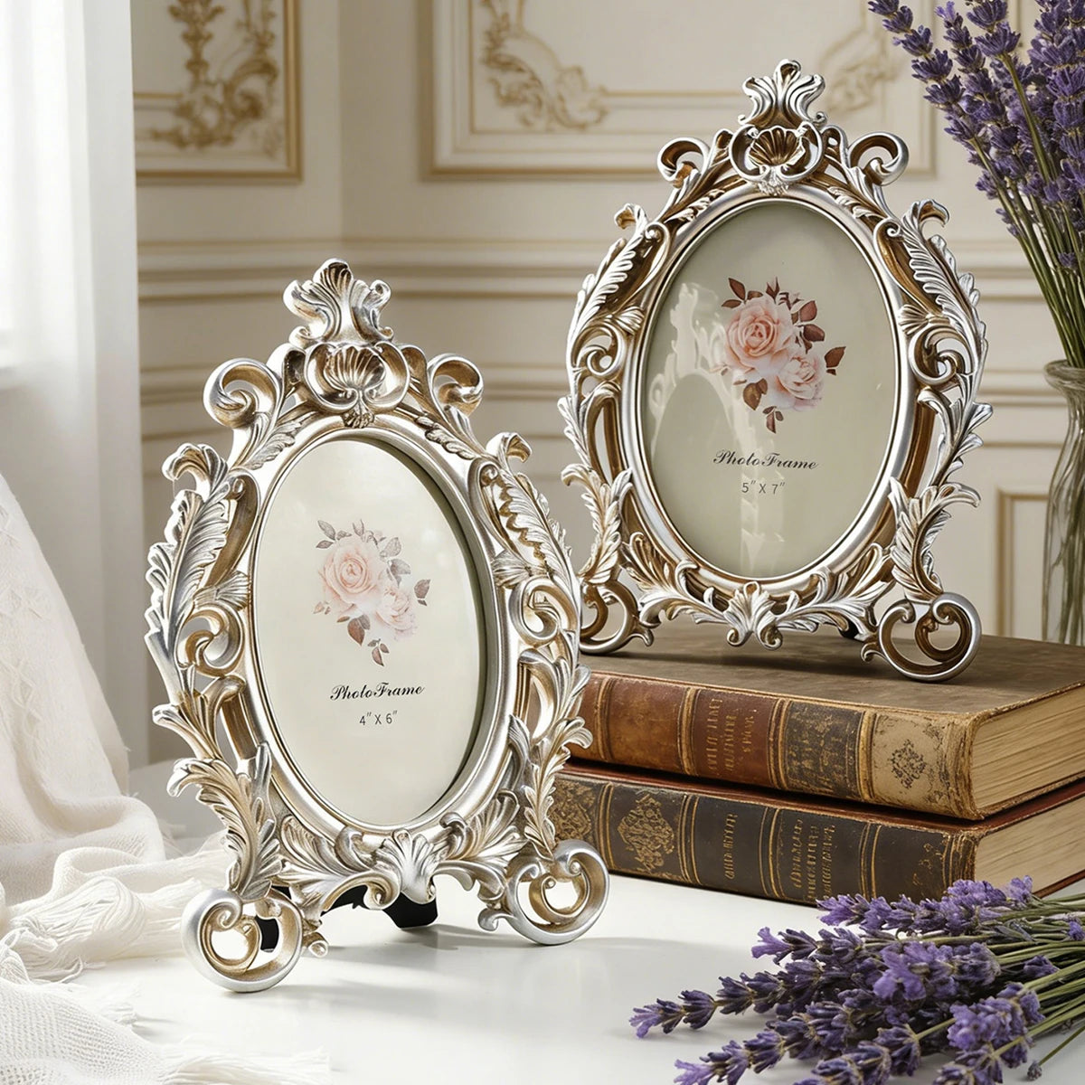 A vintage gold oval resin picture frame displayed on a wooden surface with lavender flowers.