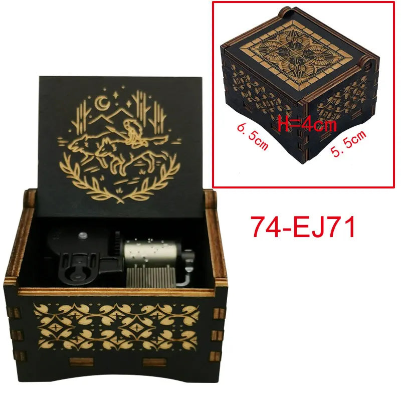 A wooden music box with intricate gold-colored patterns and a lid showing an animal design.