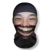 A person wearing a black headgear mask with exaggerated facial makeup for a party or cosplay.