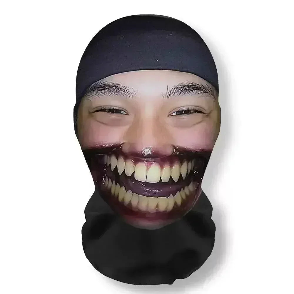 A person wearing a black headgear mask with exaggerated facial makeup for a party or cosplay.