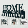 Black metal key holder with hooks for wall mounting, featuring the text HOME SWEET HOME.