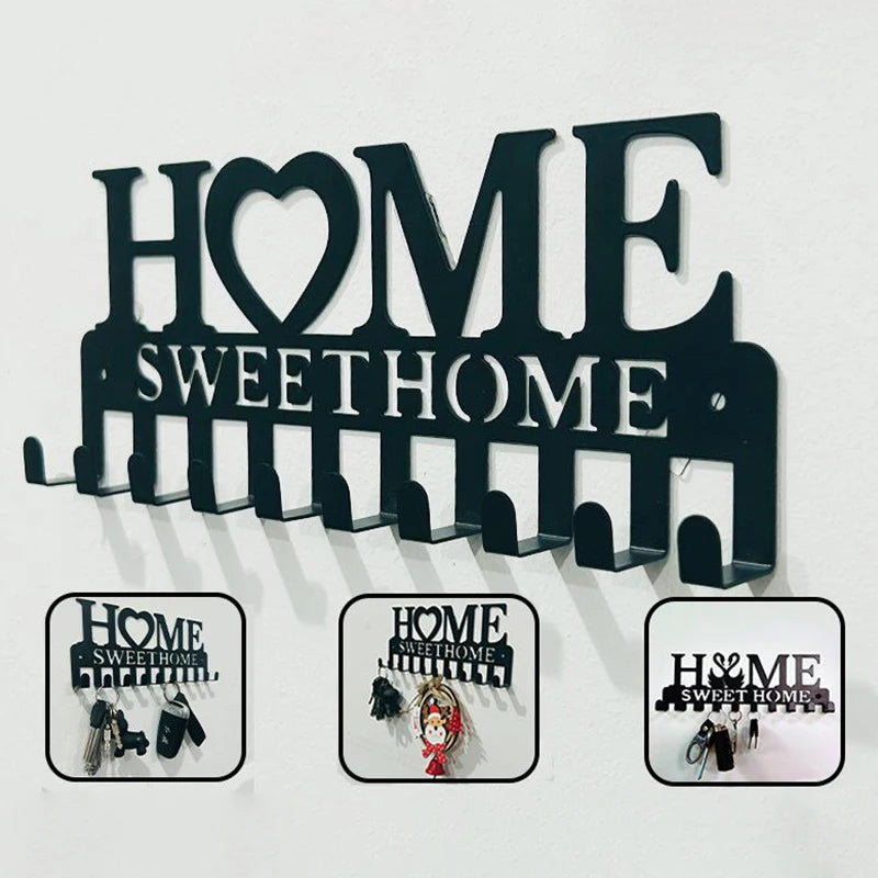 Black metal key holder with hooks for wall mounting, featuring the text HOME SWEET HOME.