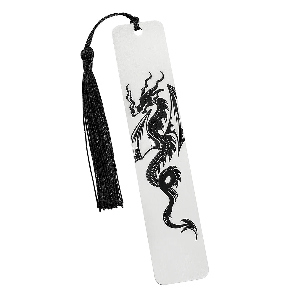 A white tag with a black dragon silhouette is attached to a black tassel, used as an elegant reading accessory.