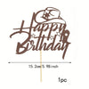 A brown glitter birthday cake topper featuring the words Happy Birthday in a western cowboy font on a wooden stick.