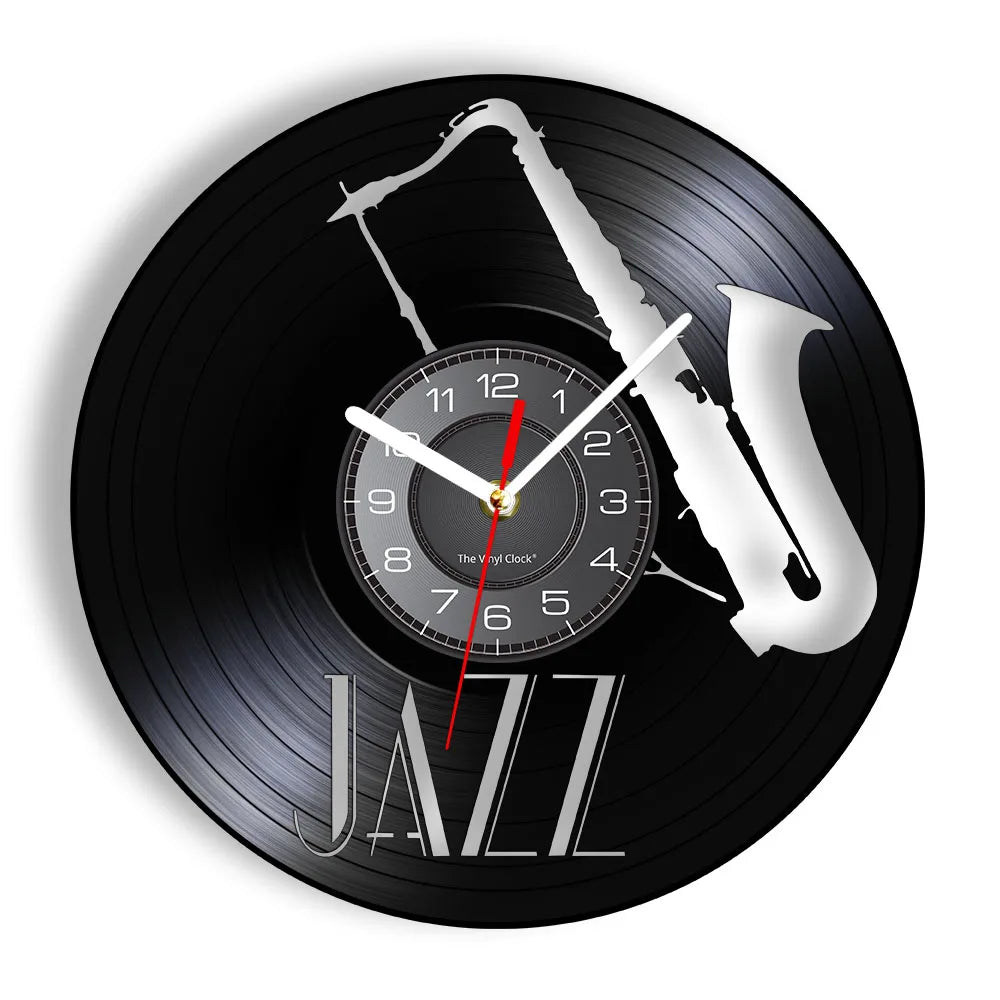 A black vinyl record-shaped wall clock featuring a silver saxophone design and the word JAZZ.