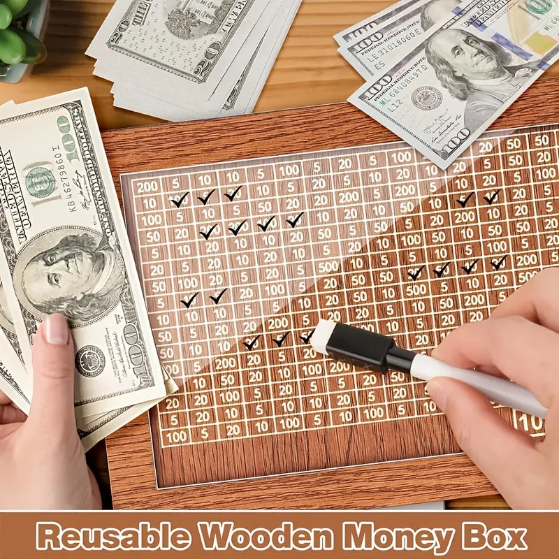 A wooden money box with a grid tracker showing progress, next to US currency bills.