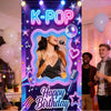 A vibrant K-Pop themed photo frame backdrop for a birthday party featuring a woman and several people.