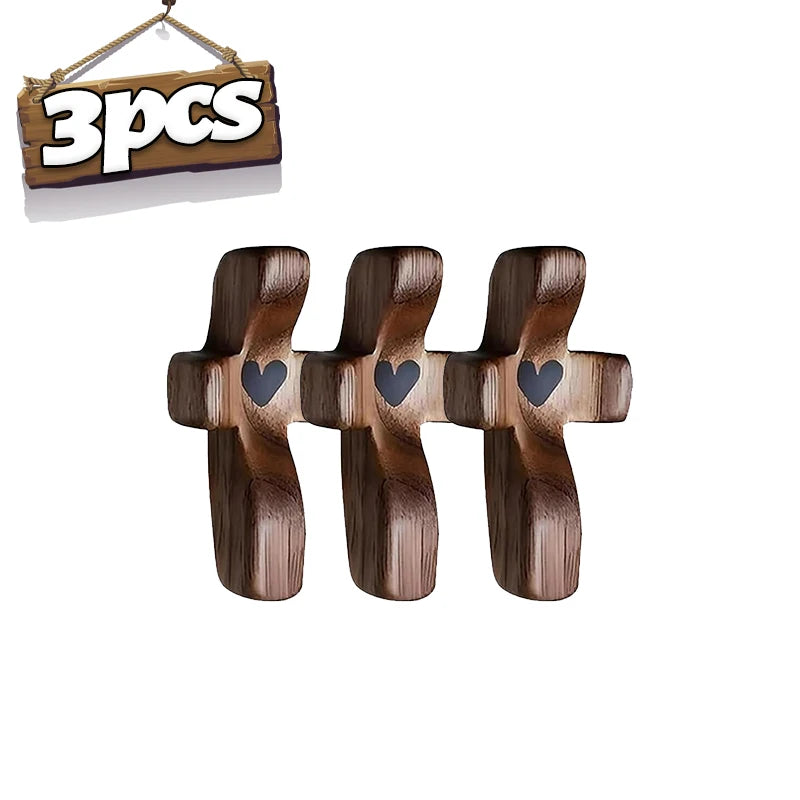 Three wooden pocket crosses for prayer and reflection displayed next to a sign indicating 3 pieces