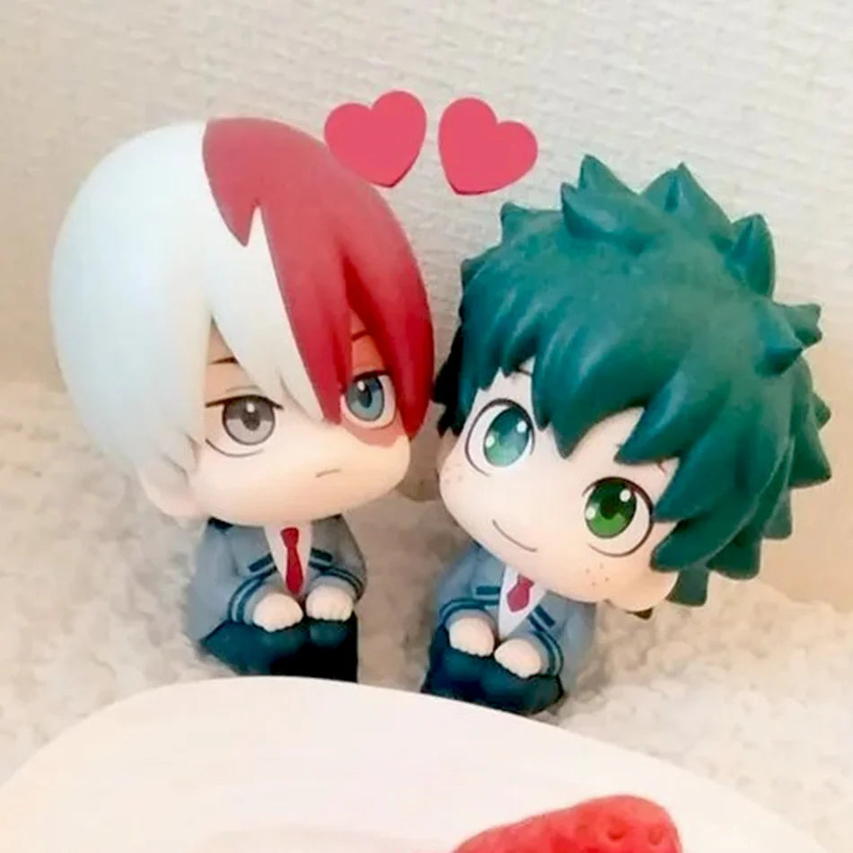 Chibi collectible figures of Izuku and Bakugo from My Hero Academia with heart accents