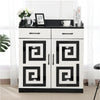 A white cabinet with black accents and glass doors displaying various home decor items.