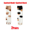A pair of spotted khaki and black cat paw print plush socks.