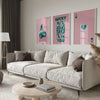 A modern living room features a light sofa, pillows, and a wooden coffee table with a retro letter art canvas set on the floo
