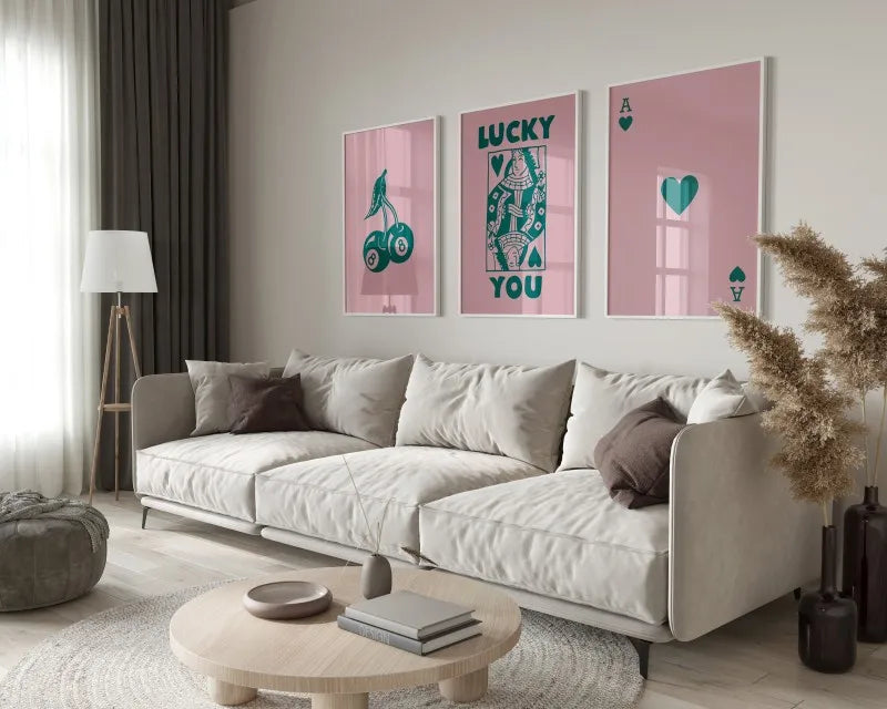 A modern living room features a light sofa, pillows, and a wooden coffee table with a retro letter art canvas set on the floo