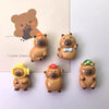A set of adorable bear-shaped refrigerator magnets in various colors and styles.