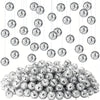 A large pile of silver mini disco mirror balls with strings hanging above them.