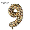 A large, gold leopard print number balloon shaped like the number 9.