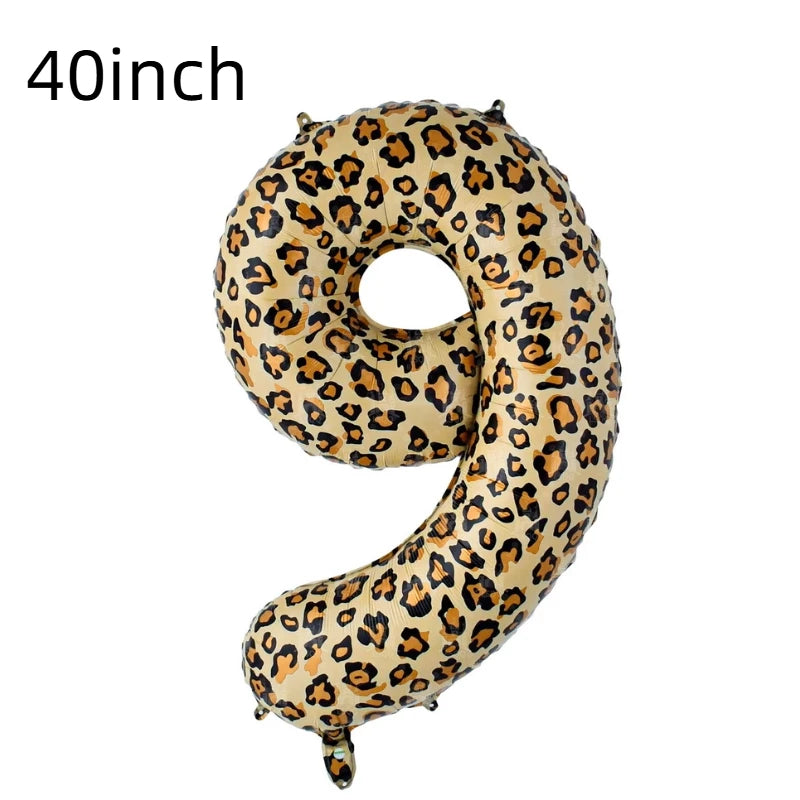 A large, gold leopard print number balloon shaped like the number 9.