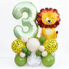 A set of green and yellow foil balloons shaped like the number three and a lion face for a birthday party