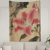 A wall tapestry featuring a large pink lily flower with green leaves on a beige background.