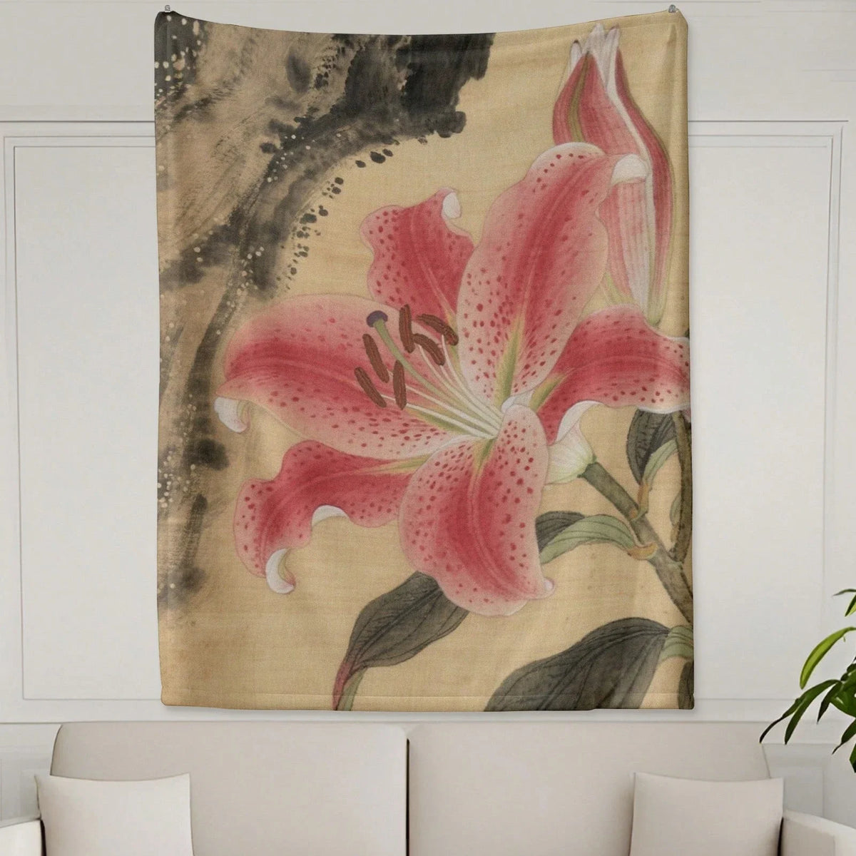 A wall tapestry featuring a large pink lily flower with green leaves on a beige background.