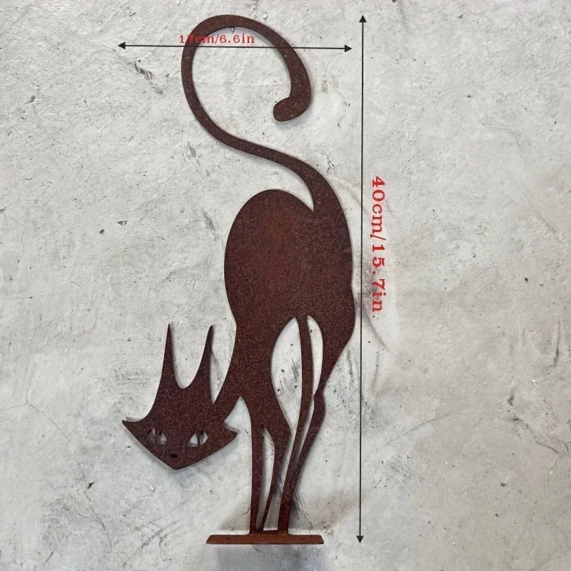 A silhouette of a cat with pointed ears standing on a base, made of dark brown wrought iron.