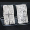 A collection of silver bullion bar replicas, including a 1/4 ounce silver bar and a stagecoach silver bar.