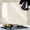 A hand holds a black film demonstrating an oil-proof wall sticker product against a tiled background.
