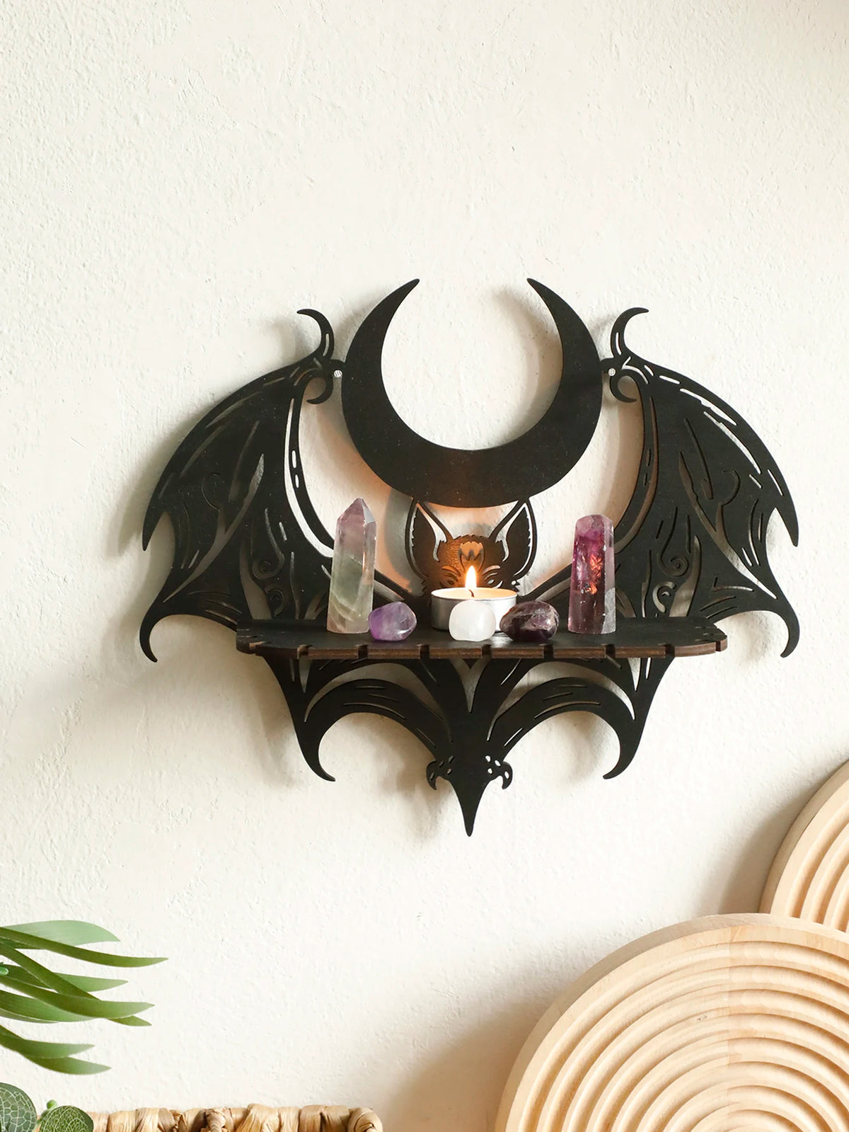 Black gothic bat moon floating wall decor featuring amethyst and rose quartz crystals on a wooden shelf