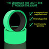 A roll of bright green glow-in-the-dark safety warning tape with a black core.